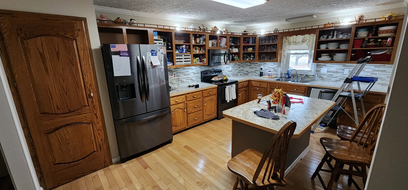 Kitchen with wood cabinetry and a central island